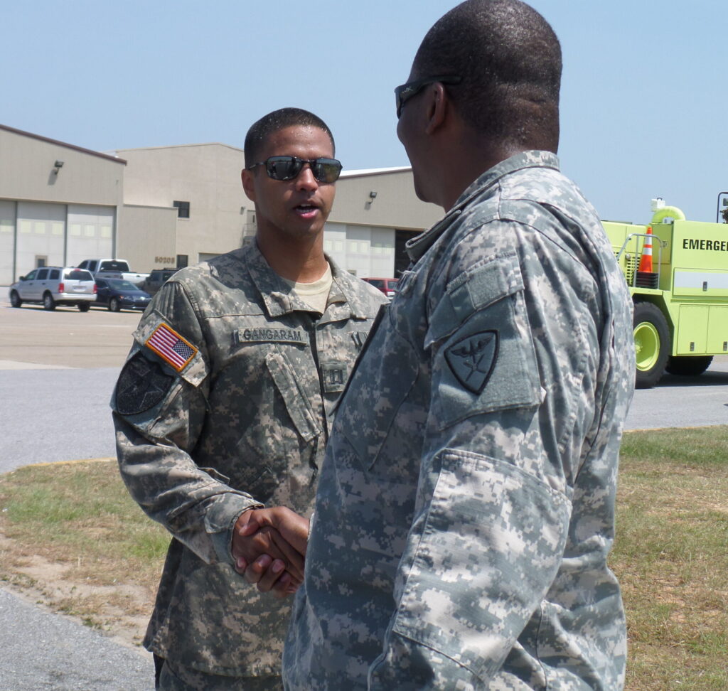 Gerald shaking hands with Soldier